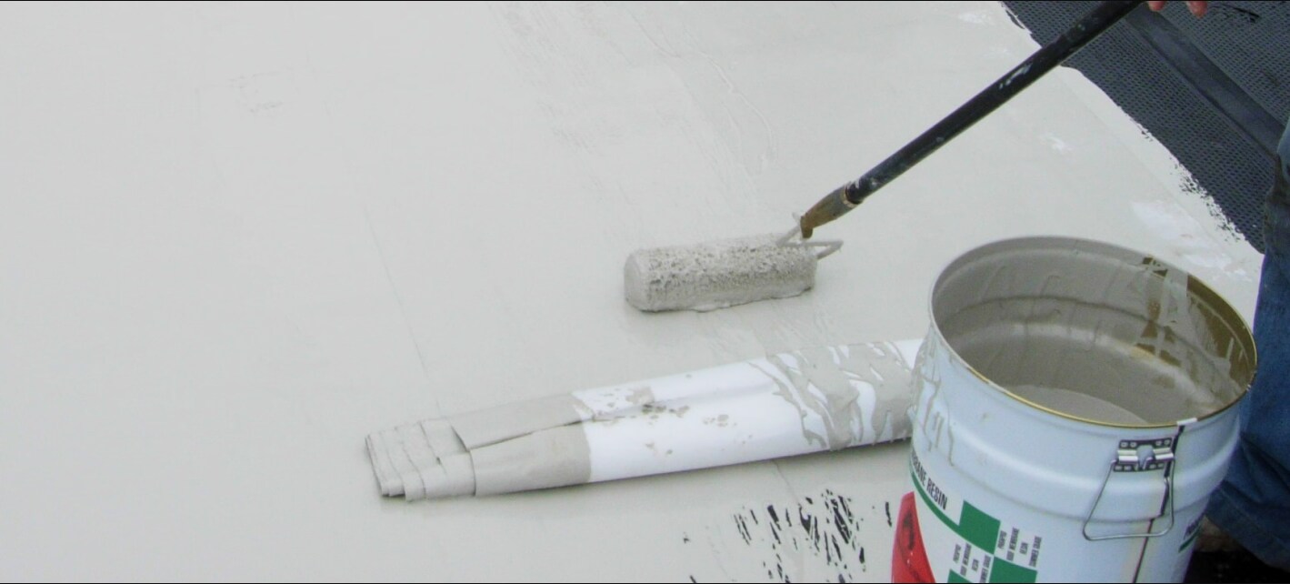 Roof membrane being rolled out